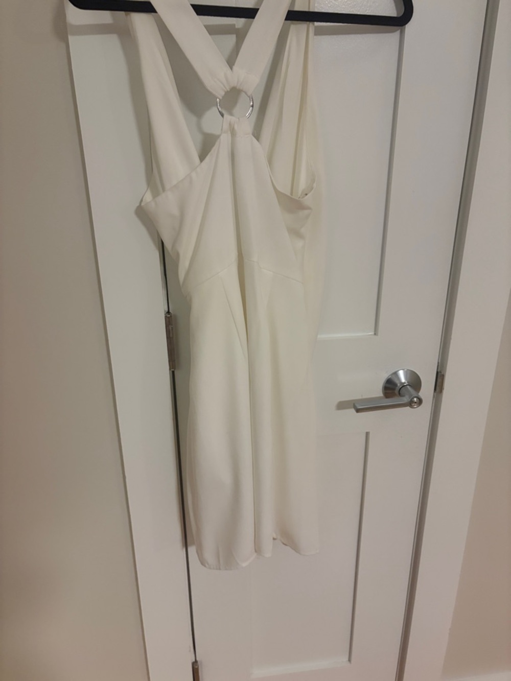 The clothing company Ivory Halter Mini Dress with Silver Ring